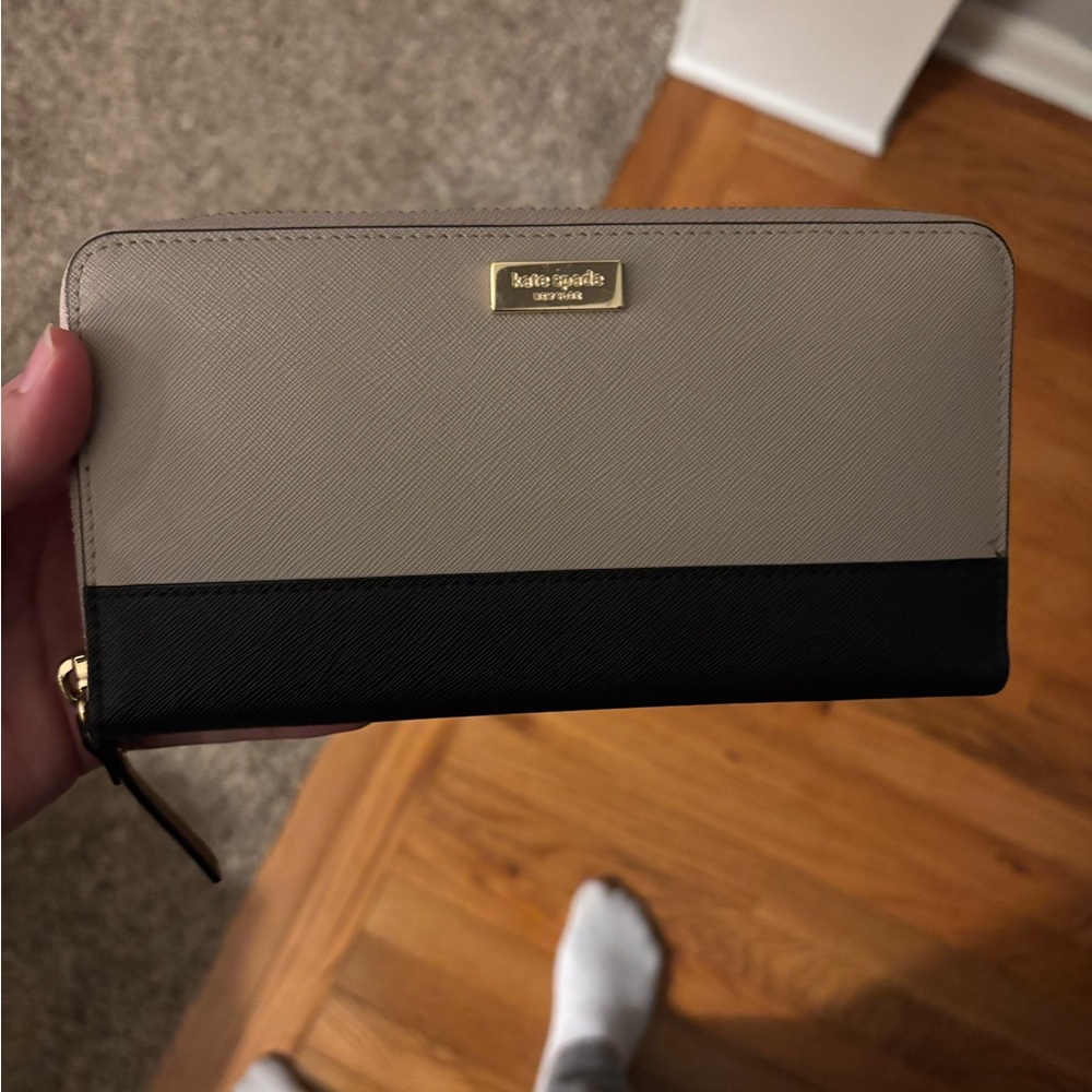 Kate Spade Laurel Way Neda zip-around wallet in taupe and black saffiano leather